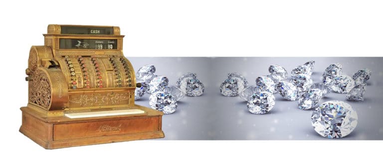 an antique cash register and several sparkling diamonds